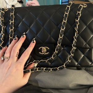 Chanel Black Quilted lambskin double flap Leather Bag
